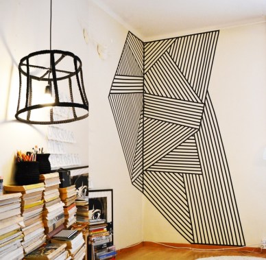 Wall decoration made with black plastic tape. By Finnish designer Molla Mills. 